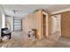 Spacious garage with concrete floor, drywall walls, and a storage area at 679 N Endeavour Dr, Winter Springs, FL 32708