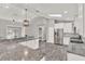 Kitchen with granite counters, stainless steel appliances, and wood-look tile at 679 N Endeavour Dr, Winter Springs, FL 32708