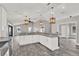 A spacious kitchen with granite countertop island and lots of natural light at 679 N Endeavour Dr, Winter Springs, FL 32708