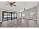 Spacious living room featuring tile floors and glass sliding doors to the patio at 679 N Endeavour Dr, Winter Springs, FL 32708