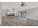 Open-concept living space with a large island, modern lighting, and tile floors at 679 N Endeavour Dr, Winter Springs, FL 32708