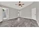 Light-filled main bedroom features an ensuite bathroom with tiled shower and wood-look floors at 679 N Endeavour Dr, Winter Springs, FL 32708