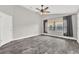 Light-filled main bedroom boasts wood-look floors and a bright window with curtains at 679 N Endeavour Dr, Winter Springs, FL 32708