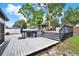 Backyard view of the pool deck with outdoor seating and an above-ground pool at 679 N Endeavour Dr, Winter Springs, FL 32708