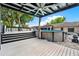 Backyard pool deck with above ground pool and ceiling fan covered pergola at 679 N Endeavour Dr, Winter Springs, FL 32708