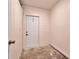 Simple storage room with painted concrete walls and door to the exterior at 679 N Endeavour Dr, Winter Springs, FL 32708