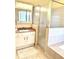 Bathroom features a granite countertop, large mirror, walk-in shower, and soaking tub at 7011 Archwood Dr, Orlando, FL 32819
