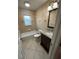 Bathroom features a granite vanity, standard toilet, and shower-tub combo at 7011 Archwood Dr, Orlando, FL 32819