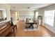 Spacious dining room with an elegant table set, adjacent to other living spaces at 7011 Archwood Dr, Orlando, FL 32819