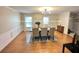 Formal dining room is spacious with windows offering ample natural light for gatherings at 7011 Archwood Dr, Orlando, FL 32819