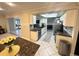 Well lit kitchen featuring white cabinets, granite countertops and stainless steel appliances at 7011 Archwood Dr, Orlando, FL 32819