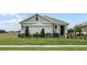 Charming single-story home with a well-manicured lawn and an attached two-car garage at 7185 Cow Prairie Rd, St Cloud, FL 34773