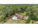 Aerial view of the property featuring a large in-ground pool, boat parking, and a well-manicured lawn at 7205 June Bug Ln, Orlando, FL 32818