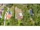 Aerial perspective of the property, showcasing the home's layout and surrounding landscaping at 7205 June Bug Ln, Orlando, FL 32818