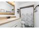 Bright bathroom with a granite countertop vanity and a shower/tub combo at 7205 June Bug Ln, Orlando, FL 32818