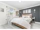 Stylish bedroom with a wooden headboard and decorative wall art at 7205 June Bug Ln, Orlando, FL 32818