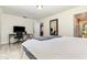 Cozy bedroom with a workspace and a large white bed at 7205 June Bug Ln, Orlando, FL 32818