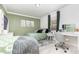 Bright bedroom featuring two beds, a beanbag chair, and a vanity at 7205 June Bug Ln, Orlando, FL 32818