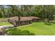 Exterior aerial view of home with well-manicured lawn and mature landscaping at 7205 June Bug Ln, Orlando, FL 32818