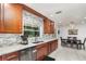 Bright eat-in kitchen featuring marble countertops, stainless steel appliances, and a charming breakfast nook at 7205 June Bug Ln, Orlando, FL 32818