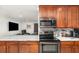 Modern kitchen featuring marble countertops, stainless steel appliances, and a sleek, functional design at 7205 June Bug Ln, Orlando, FL 32818