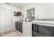 Functional laundry room with modern appliances, sink, and ample counter space at 7205 June Bug Ln, Orlando, FL 32818
