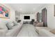 Bright and airy living room featuring neutral tones, tile flooring, and a comfortable seating area at 7205 June Bug Ln, Orlando, FL 32818