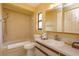 Neutral bathroom features a tub with shower, toilet, and vanity with a sink and a medicine cabinet at 8143 Terragona Ct, Orlando, FL 32836