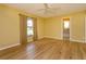 Bright bedroom features wooden floor, large window and bright interior paint at 8143 Terragona Ct, Orlando, FL 32836
