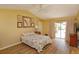 Cozy bedroom with ample natural light coming through the sliding glass door at 8143 Terragona Ct, Orlando, FL 32836