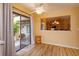 Cozy dining area with a view of the patio and kitchen, featuring a wooden floor at 8143 Terragona Ct, Orlando, FL 32836