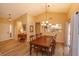 Well-lit dining room leading to the foyer and offering a glimpse into the kitchen at 8143 Terragona Ct, Orlando, FL 32836