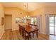 Dining room with a clear view into the adjacent kitchen and pool area at 8143 Terragona Ct, Orlando, FL 32836