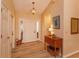 Bright foyer with wooden floors, a white front door, and warm, neutral tones at 8143 Terragona Ct, Orlando, FL 32836