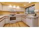 Well-lit kitchen with modern oven, stainless steel sink and ample counter space at 8143 Terragona Ct, Orlando, FL 32836