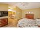 Bright main bedroom features wooden floors, attached bathroom and walk-in closet at 8143 Terragona Ct, Orlando, FL 32836