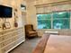 Charming bedroom with scenic views, hard surface floors, and a decorative color scheme at 932 S Lake Sterling Ct, Casselberry, FL 32707