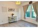 Bright dining area with stylish decor, elegant lighting, and a large window for natural light at 932 S Lake Sterling Ct, Casselberry, FL 32707