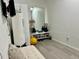 Bright bonus room includes a workout area, large mirror, and white leather seating at 932 S Lake Sterling Ct, Casselberry, FL 32707