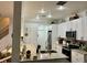 Bright kitchen featuring granite counters, stainless appliances, and ample cabinet space for storage at 932 S Lake Sterling Ct, Casselberry, FL 32707