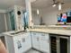 Modern kitchen with granite counters, stainless steel appliances, and eat in bar area at 932 S Lake Sterling Ct, Casselberry, FL 32707