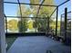 Enjoy outdoor living on this screened patio with peaceful lake views, plenty of sunshine, and room for seating at 932 S Lake Sterling Ct, Casselberry, FL 32707