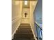 Ascending staircase with white banisters leads to the upper level of this home at 932 S Lake Sterling Ct, Casselberry, FL 32707