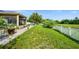 Expansive backyard with well-maintained grass, complemented by a home and patio, perfect for outdoor enjoyment at 969 Springs Landing Dr, Deltona, FL 32725