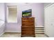 Bedroom featuring a TV on a dresser, a window with blinds, and neutral colored walls at 969 Springs Landing Dr, Deltona, FL 32725