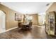 Elegant dining room featuring dark wood flooring, chandelier, and decorative painting at 969 Springs Landing Dr, Deltona, FL 32725