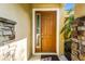 Close-up of a stylish front door with stone accents and sidelight window at 969 Springs Landing Dr, Deltona, FL 32725