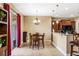 Open-concept kitchen area with tile floors, a dining table, and granite countertops at 969 Springs Landing Dr, Deltona, FL 32725