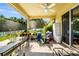 Covered patio with a ceiling fan and views of the backyard, perfect for outdoor living and entertaining at 969 Springs Landing Dr, Deltona, FL 32725