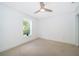 Bright bedroom with carpet, a ceiling fan, and a large window at 1000 Chesterfield Cir, Winter Springs, FL 32708
